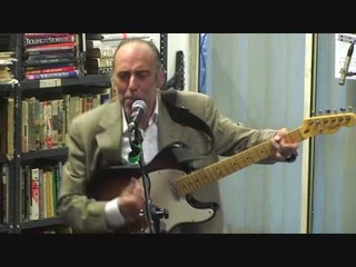Mick Jones sings 'Should I stay or should I go at the Rock and Roll Public Library